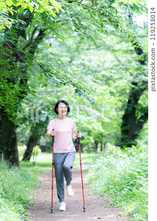 A middle-aged woman walking 119258014