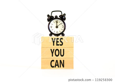 Motivational and Yes you can symbol. Concept words Yes you can on beautiful wooden blocks. Beautiful white background. Black alarm clock. Business motivational and Yes you can concept. Copy space. Motivational and Yes you can symbol. Concept words Yes you can on beautiful wooden blocks. Beautiful white background. Black alarm clock. Business motivational and Yes you can concept. Copy space. 119258300