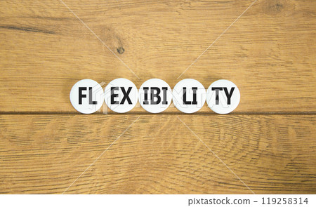 Flexibility symbol. Concept word Flexibility on beautiful white pill. Beautiful wooden background. Business flexibility concept. Copy space. Flexibility symbol. Concept word Flexibility on beautiful white pill. Beautiful wooden background. Business flexibility concept. Copy space. 119258314