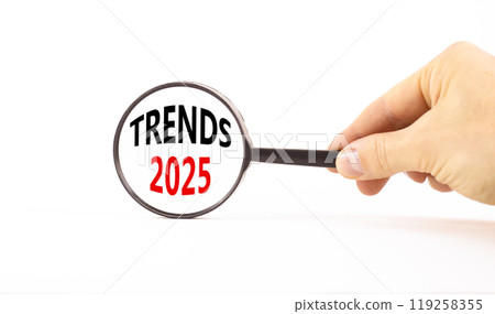 Planning trends 2025 new year symbol. Concept words Trends 2025 on beautiful white paper in magnifying glass. Beautiful white paper background. Business trends 2025 new year concept. Copy space. 119258355