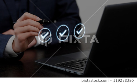Hands of a businessman checking data 119258380
