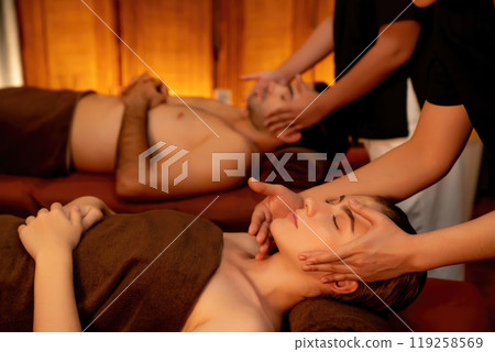 Couple customer enjoying relaxing anti-stress head massage. Quiescent 119258569