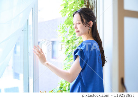Woman looking at the view outside 119258655