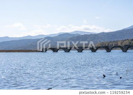 Taushubetsu River Bridge on the former Shihoro Line of the Japanese National Railways on a clear autumn day in Kamishihoro, Hokkaido 119259234