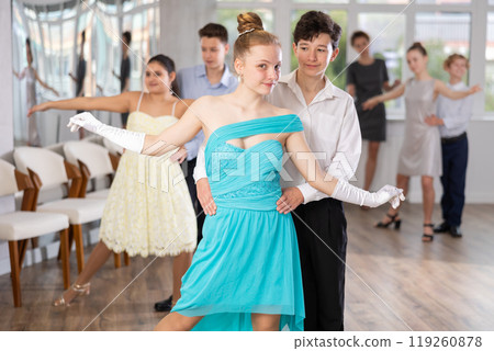 Boy and girl dancing ballroom dance in studio 119260878