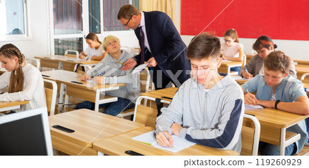 Teenage students working at class during lesson Teenage students working at class during lesson 119260929