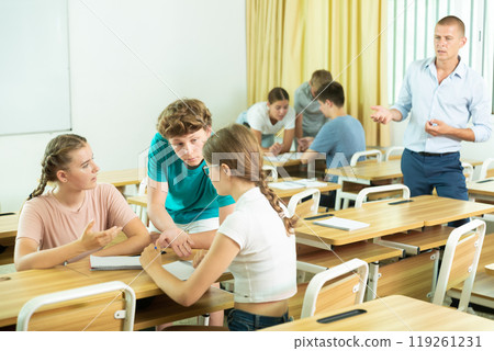 Teenager students performing group tasks Teenager students performing group tasks 119261231