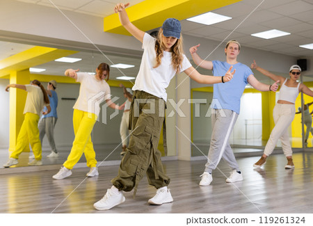 Teen girl in cap dancing modern dances 119261324