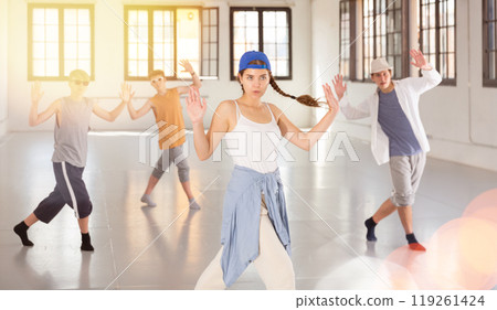 Teenage girl practicing active dance at studio 119261424