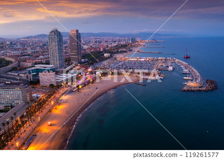 Aerial view of Barcelona cityscape on Mediterranean coast at summer twilight 119261577
