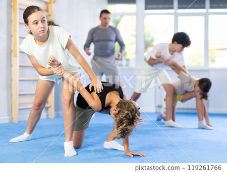 Boy and girl practicing self-defense techniques Boy and girl practicing self-defense techniques 119261766