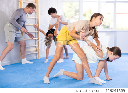 Two girls training self-defense techniques Two girls training self-defense techniques 119261869