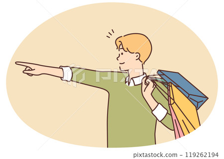 Happy man with shopping bags point with finger 119262194