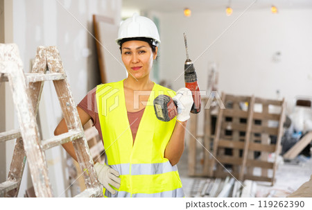 Portrait of asian woman builder with drill 119262390