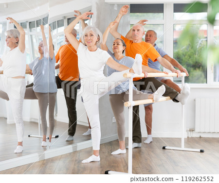 Ballet pose grand batman - elderly women and men at choreography lesson 119262552