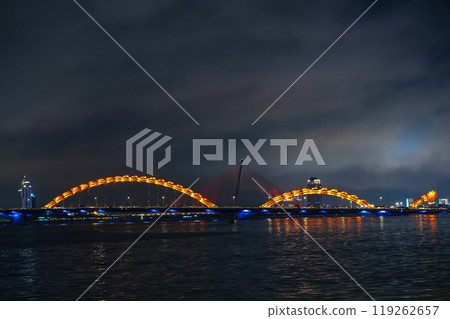 Famous landmark is Dragon Bridge or Cau Rong over the Han River in Da Nang in Vietnam at night with illumination 119262657