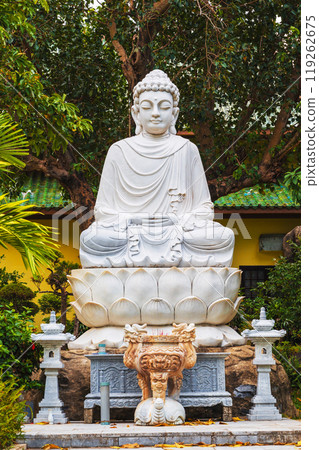 white Buddhist statue of a sitting Buddha in park at the Linh Ung Pagoda in Da Nang in Vietnam in summer in Asia white Buddhist statue of a sitting Buddha in park at the Linh Ung Pagoda in Da Nang in Vietnam in summer in Asia 119262675