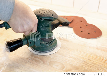 Work with a grinder on wood. Work tool. Work with a grinder on wood. Work tool. 119263166