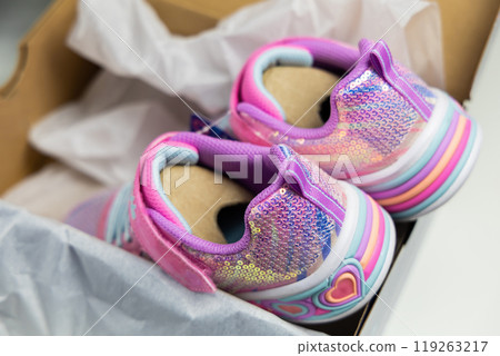 Children's sports shoes. New fashion sneakers for children in box. Children's sports shoes. New fashion sneakers for children in box. 119263217