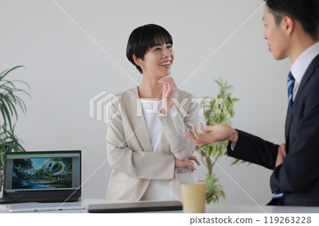 A businesswoman who is asked a question and thinks while answering_1 A businesswoman who is asked a question and thinks while answering_1 119263228