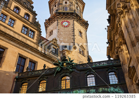 Ornate bridge with carvings and statues connects two buildings in Dresden Castle complex. Historical architecture in Germany 119263385