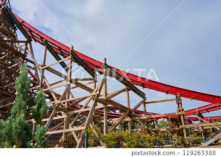 Roller coaster attraction in amusement park. Entertainment at summer holiday Roller coaster attraction in amusement park. Entertainment at summer holiday 119263388