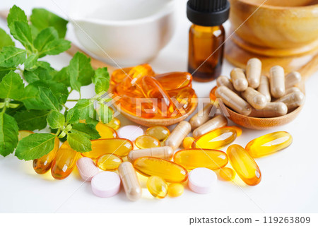 Alternative medicine herbal organic capsule with vitamin E omega 3 fish oil, mineral, drug with herbs leaf natural supplements for healthy good life. Alternative medicine herbal organic capsule with vitamin E omega 3 fish oil, mineral, drug with herbs leaf natural supplements for healthy good life. 119263809