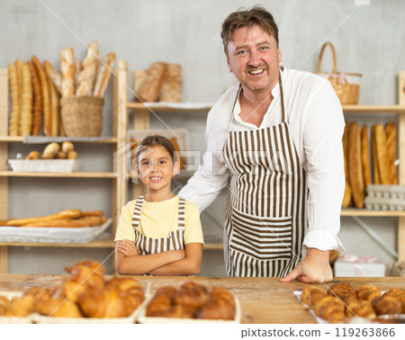 Father and little daughter - selling bread and various baguettes for sale Father and little daughter - selling bread and various baguettes for sale 119263866