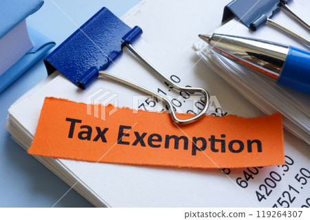Tax exemption documents on a table. 119264307