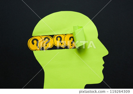 A paper head with question marks. Uncertainty and the search for answers. 119264309