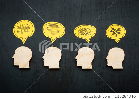 Heads with symbols of negative emotions and stress. Mental strain and emotional challenges. 119264310