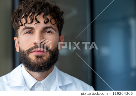 Man dentist with braces showing importance of dental care in orthodontics while smiling for the camera Man dentist with braces showing importance of dental care in orthodontics while smiling for the camera 119264366