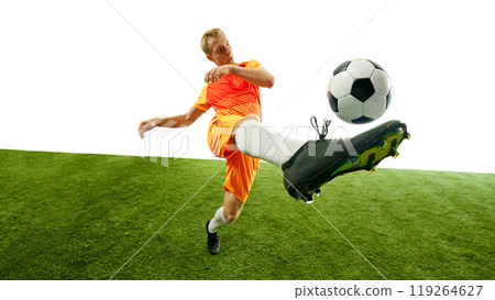 Focused player advances with ball, his powerful legs propelling him toward his target. Every muscle engaged, showcasing intensity of sport. 119264627