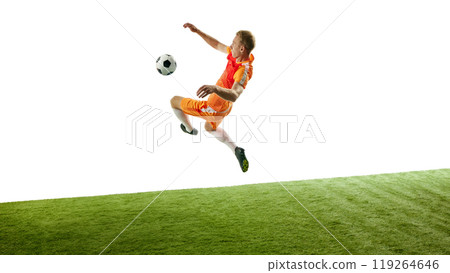 Young soccer player positions for epic kick, pushing limits of his flexibility, skill, and dedication to game. Movement. Young soccer player positions for epic kick, pushing limits of his flexibility, skill, and dedication to game. Movement. 119264646