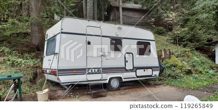 Caravan, camping in the forest. Bulgarian Rhodope Mountains. Lake Dospat. Balkans. Sarnitsa, Pazardzhik Province. Close-up shot of forest landscape 119265849