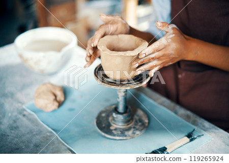 Female artist sculpts crafts with ceramic clay at her creative workshop 119265924