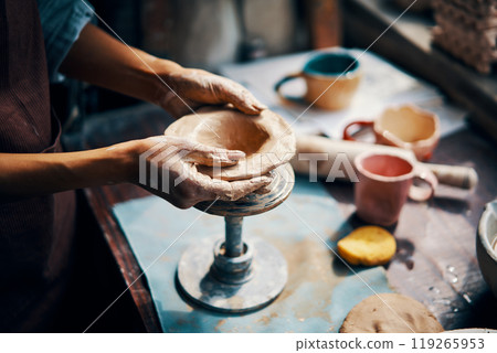 Female artist sculpts crafts with ceramic clay at her creative workshop Female artist sculpts crafts with ceramic clay at her creative workshop 119265953