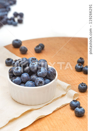 Bowl of blueberries on a wooden tray. Wild berries. Healthy eating 119266291