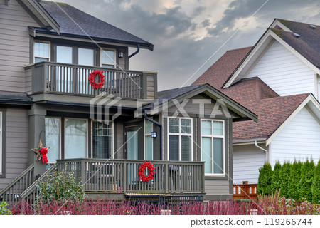 Fragment of a residential house with Christmas decorations Fragment of a residential house with Christmas decorations 119266744