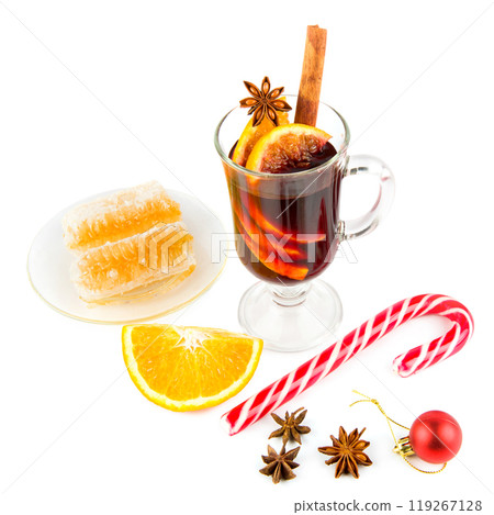 Hot red mulled wine isolated on a white with christmas spices, orange slice, anise and cinnamon sticks. Free space for text. 119267128