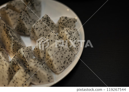 Pieces of fresh white dragon fruit in a plate. 119267544