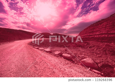 Mountain landscape. Desert in Viva Magenta trendy color toning. National Park Makhtesh Ramon Crater in Negev desert, Israel Mountain landscape. Desert in Viva Magenta trendy color toning. National Park Makhtesh Ramon Crater in Negev desert, Israel 119268396