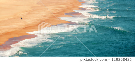 Ocean waves roll on the sandy beach. Drone view. Horizontal banner 119268425
