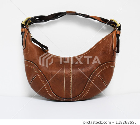 Vintage brown leather hobo bag on white background 119268653