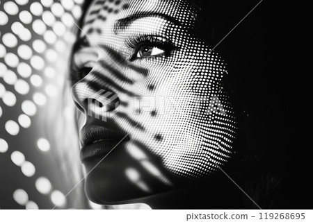 Mesmerizing light patterns on woman's face in black and white photography 119268695