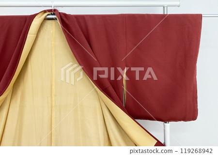 Colorful kimono robe on a hanger, promo photo for an online women's clothing store Colorful kimono robe on a hanger, promo photo for an online women's clothing store 119268942