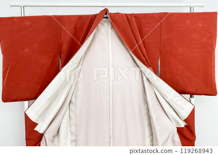 Colorful kimono robe on a hanger, promo photo for an online women's clothing store Colorful kimono robe on a hanger, promo photo for an online women's clothing store 119268943