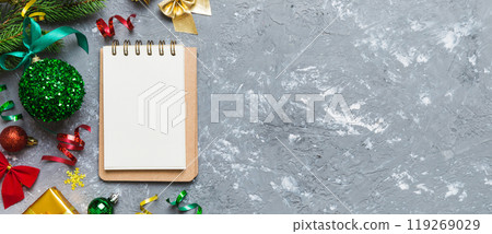Christmas blank greeting card mock-up scene. Creative layout made of Christmas tree branches and paper card note. Flat lay. Nature New Year concept Christmas blank greeting card mock-up scene. Creative layout made of Christmas tree branches and paper card note. Flat lay. Nature New Year concept 119269029