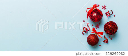 Christmas ball on colored background. decoration bauble with ribbon bow with copy space Christmas ball on colored background. decoration bauble with ribbon bow with copy space 119269082