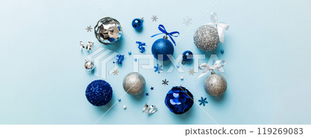 Christmas ball on colored background. decoration bauble with ribbon bow with copy space Christmas ball on colored background. decoration bauble with ribbon bow with copy space 119269083